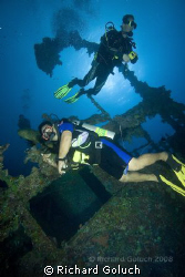 Divers cheking out Nippo Maru-Truk Lagoon by Richard Goluch 